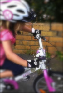 pink_kids_bike_helmet_and_bike